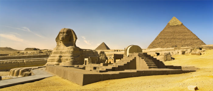 Sphinx in Giza with Khufu Pyramid in Egypt