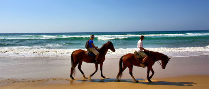 Riding along the beach in Mozambique