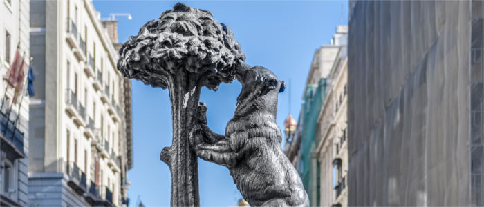 Monument with bear and tree