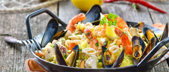 Mixed paella made with meat and prawns