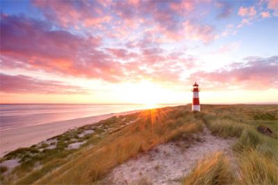 Dunes and a lighthouse at the North Sea